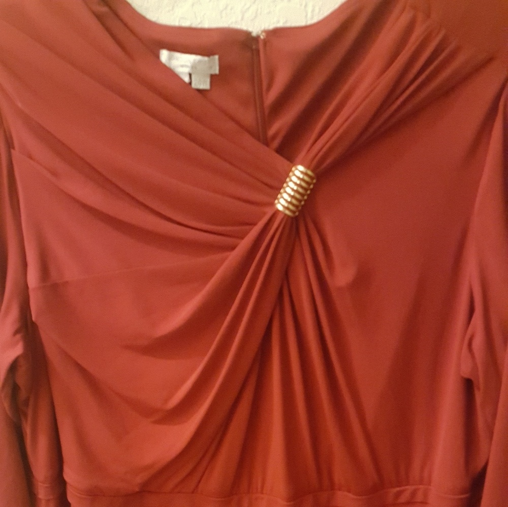 Stunning red dress with gold accent.